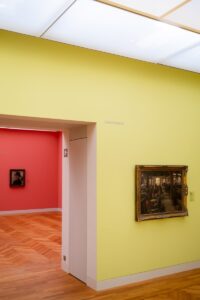 a room with a painting on the wall and a painting on the wall